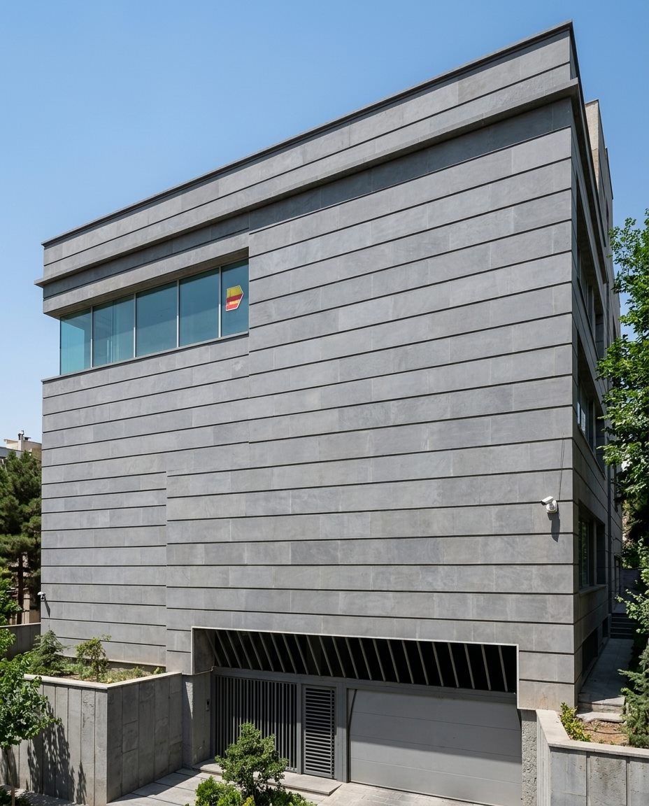 Contemporary building clad in large-format honed basalt panels