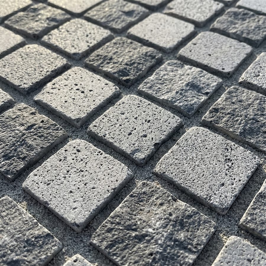 Basalt setts with characteristic volcanic pores, laid diagonally