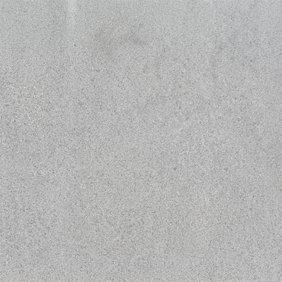 Close-up of honed basalt with a smooth, evenly matte grey surface